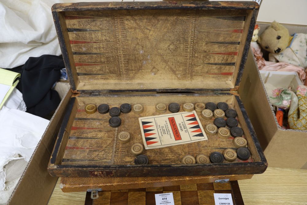 Three chess / backgammon boards and a few pieces